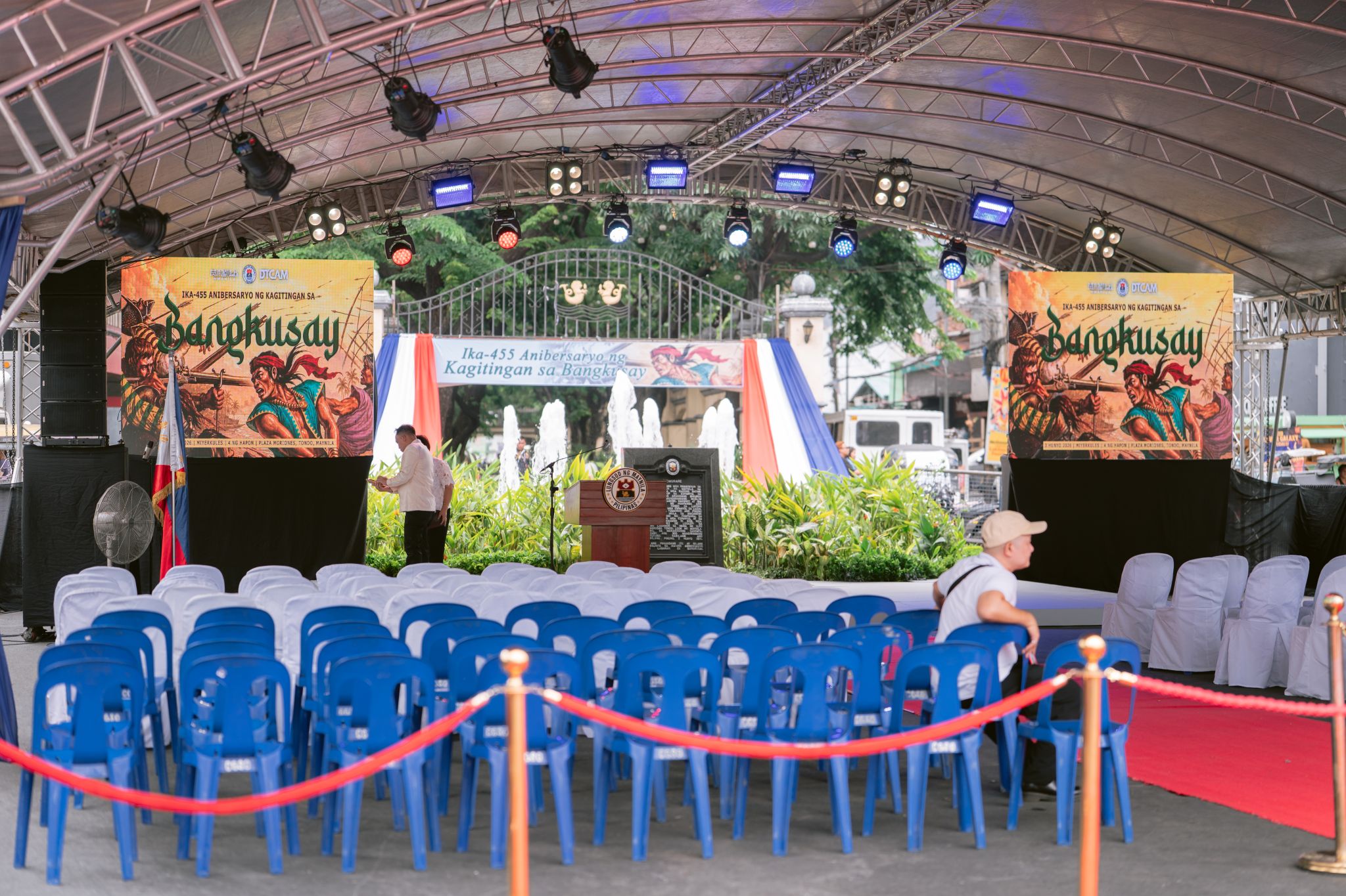 Covered plaza stage with trussing, LED panels and speakers at Plaza Moriones